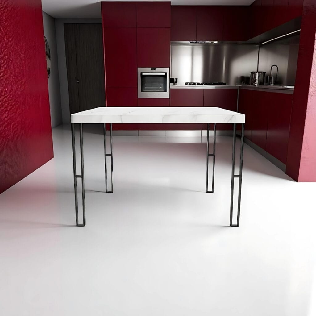 Gambe in ferro per tavoli modello Lyra installate in cucina con arredi rosso bordeaux e pavimento bianco lucido – Decimus